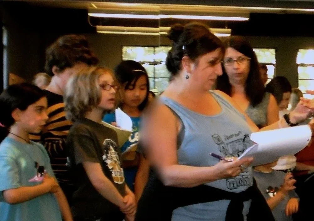 Angela Rinaldi-Gribas working with young performers, from Variety Plus Theater