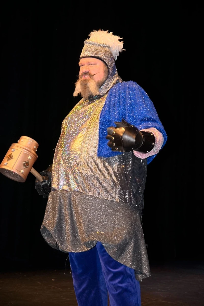 Frog Prince archival stage photograph: a costumed performer with a prop mallet
